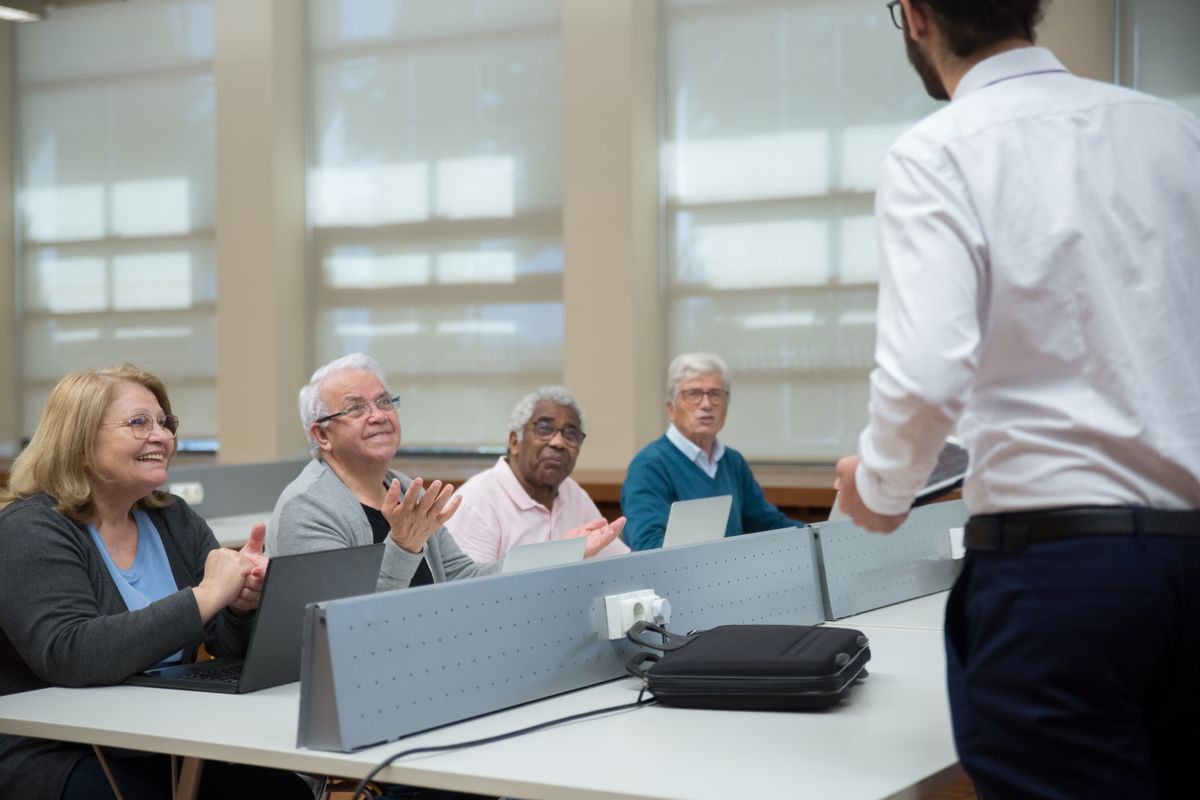 Someone completing an online training course at a laptop