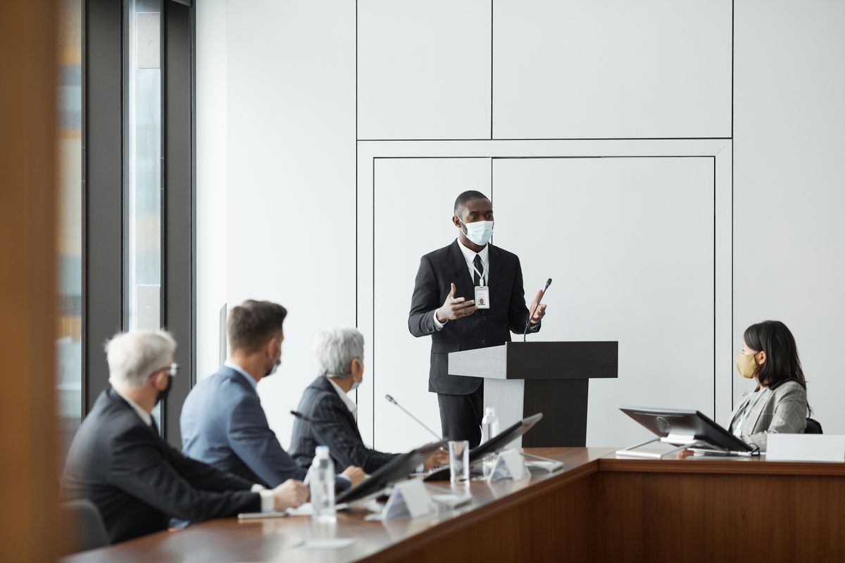A team comparing pricing options in an office meeting